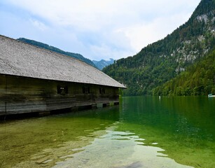 Old wooden boathouse on the lake. Mountain bavarian  landscape. 