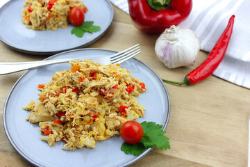 Cauliflower rice and chicken on a wooden board