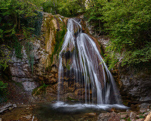Obraz premium waterfall in the green forest