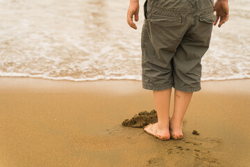 child playing on the beach