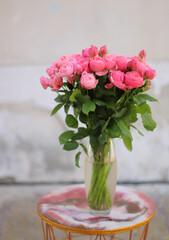 Beautiful flower bouquet of pink rose. Big bouquet of roses in vase on table.