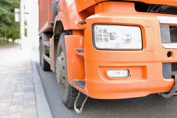Truck is standing on roadway front bumper closeup. Rent and rental of trucks concept