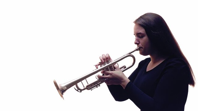 Piccolo trumpet player. White background