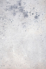 Light blue wall with abstract spots. Beautiful gray, white texture, abstract wall surface background, vintage surface texture with copy space, unusual mottled surface.
