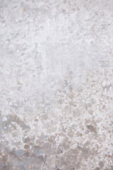 Light blue wall with abstract spots. Beautiful gray, white texture, abstract wall surface background, vintage surface texture with copy space, unusual mottled surface.