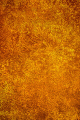 Background wall with abstract spots. Beautiful golden texture with stains, abstract surface background, modern bright painting of walls in trending shades, unusual spotty silver and gold surface.