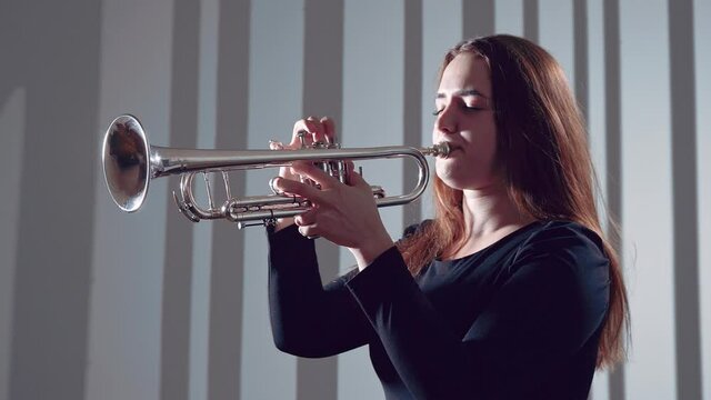 Trumpeter playing music jazz instrument 
