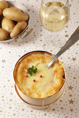 french gastronomy- cheese fondue with wine and potato