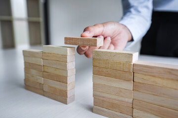 Plan and strategy in business, Risk To Make Business Growth Concept With Wooden Blocks, hand of man...