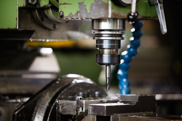 Machine tool in metal factory with drilling cnc machines