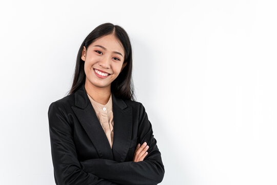 Portrait of Smiling asian happy business woman with crossed arms and looking at the camera