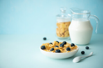 cornflakes with milk and blueberries
