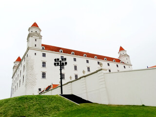 Bratislava Castle in Bratislava, Slovakia. Bratislava Castle with four corner towers stands on an isolated rocky hill of the Little Carpathians.