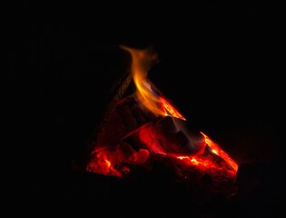 Burning coal in a fire at night