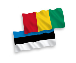 Flags of Guinea and Estonia on a white background