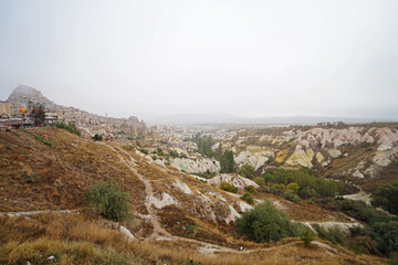 Natural landscape of Cappadocia, semi-arid region in central Turkey known for its distinctive fairy chimneys, tall cone-shaped rock formations clustered in Monks Valley, Göreme and elsewhere- Kayseri