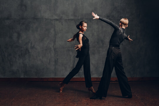 Young couple dancing in ballroom dance Paso doble