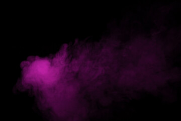 Colorful smoke close-up on a black background. Blurred pink cloud of smoke.