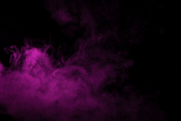 Colorful smoke close-up on a black background. Blurred pink cloud of smoke.
