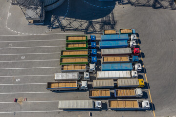 Storage area for trucks on the territory of the grain terminal. View from above. Aerial photography.