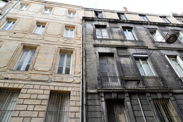 Fototapeta na wymiar Outside home facades renovation of old building before and after difference between wash clean and dirty house in street