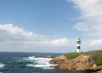 Fototapeta na wymiar lighthouse in isla pancha, asturiass spain