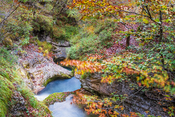 Autumn. Explosion of colors on the waterfalls and streams of the Val d'Arzino.