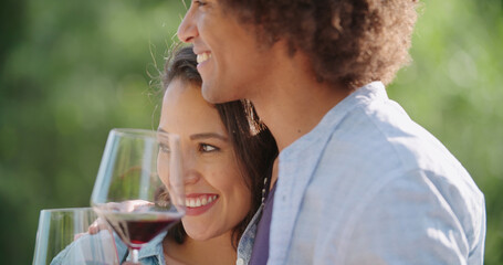 Romantic young woman and man tasting wine having exciting private degustation at italian vineyard winery. Winetasting culture. Wine tasting.Red wine tasting people enjoy drinking. close up