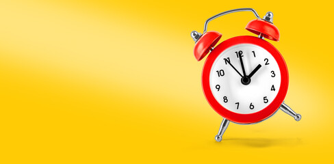 Red retro alarm clock on Yellow