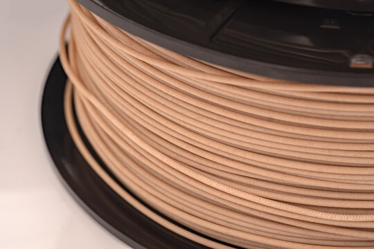 Spool Of PLA Filament For 3D Printer - Wooden Color.