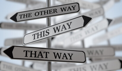 Many confusing road sign arrows pointing in different directions. 3D rendered illustration.