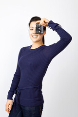 young woman holding a camera