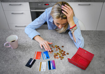 Woman counting last coins left