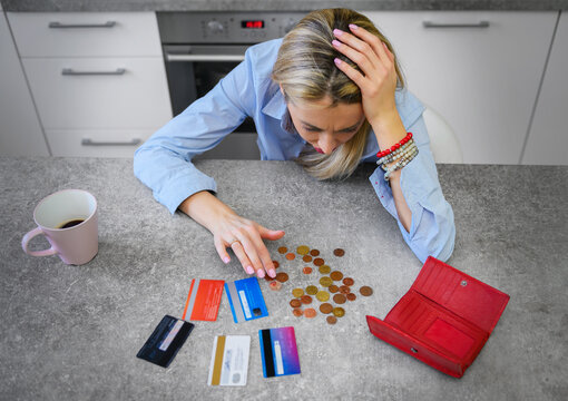 Woman Counting Last Coins Left