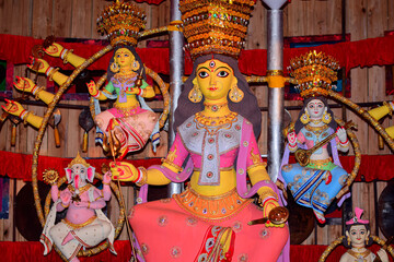 Idol of Goddess Devi Durga at a decorated puja pandal in Kolkata, West Bengal, India. Durga Puja is...