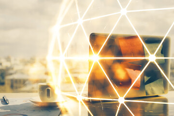 Computer on desktop with social network hologram. Multi exposure. Concept of international people connections.