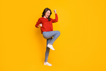 Fototapeta na wymiar Full length body size view of her she nice-looking attractive content ecstatic overjoyed cheerful cheery wavy-haired girl dancing rejoicing isolated bright vivid shine vibrant yellow color background