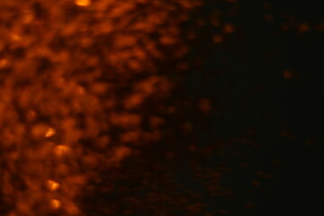 Abstract dark orange dots black background for texture