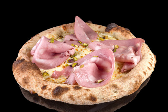 Delicious pizza with mortadella, pistachio, mushrooms, basil, and tomato sauce with reflection,