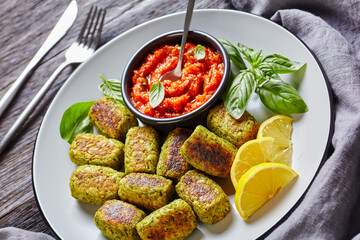 baked broccoli tots on a plate, top view