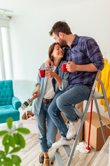 Fototapeta na wymiar Couple drinking coffee while moving in together