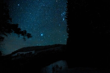 Night stars sky above mountains