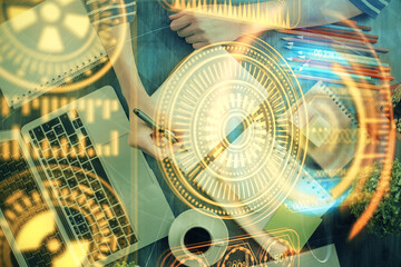 Tech theme hologram over woman's hands taking notes background. Concept of hightech. Double exposure