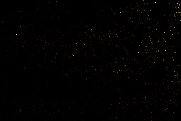 Golden abstract bokeh on black background. Holiday concept