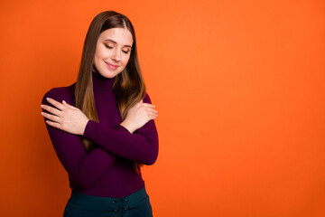 Photo of cheerful satisfied girl love herself hug cuddle close eyes wear purple jumper isolated over shine color background