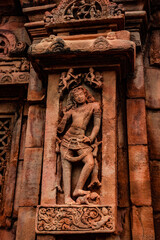 sculptures of hindu gods on facade of 7th century temple carved walls in Pattadakal