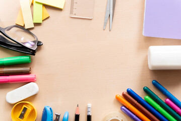 school equipment on wooden classroom desk, symbol of education a