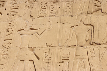 Ancient egyptian paintings and hieroglyphs on the wall in Karnak Temple Complex in Luxor, Egypt