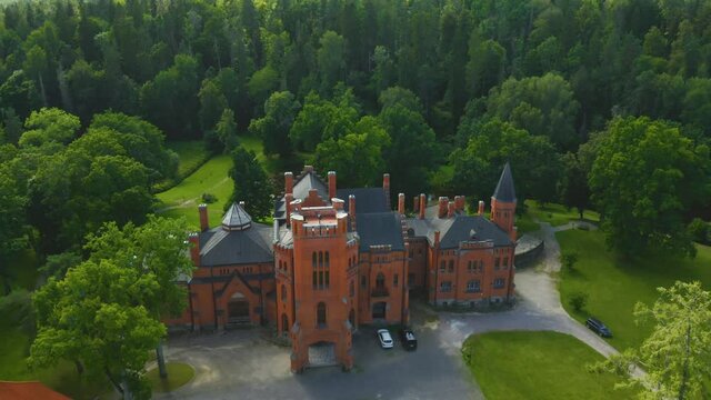 Beautiful medieval red Sangaste Castle (German: Schloss Sagnitz) and it's surroundings in country of Estonia.