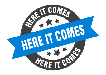 here it comes sign. round ribbon sticker. isolated tag